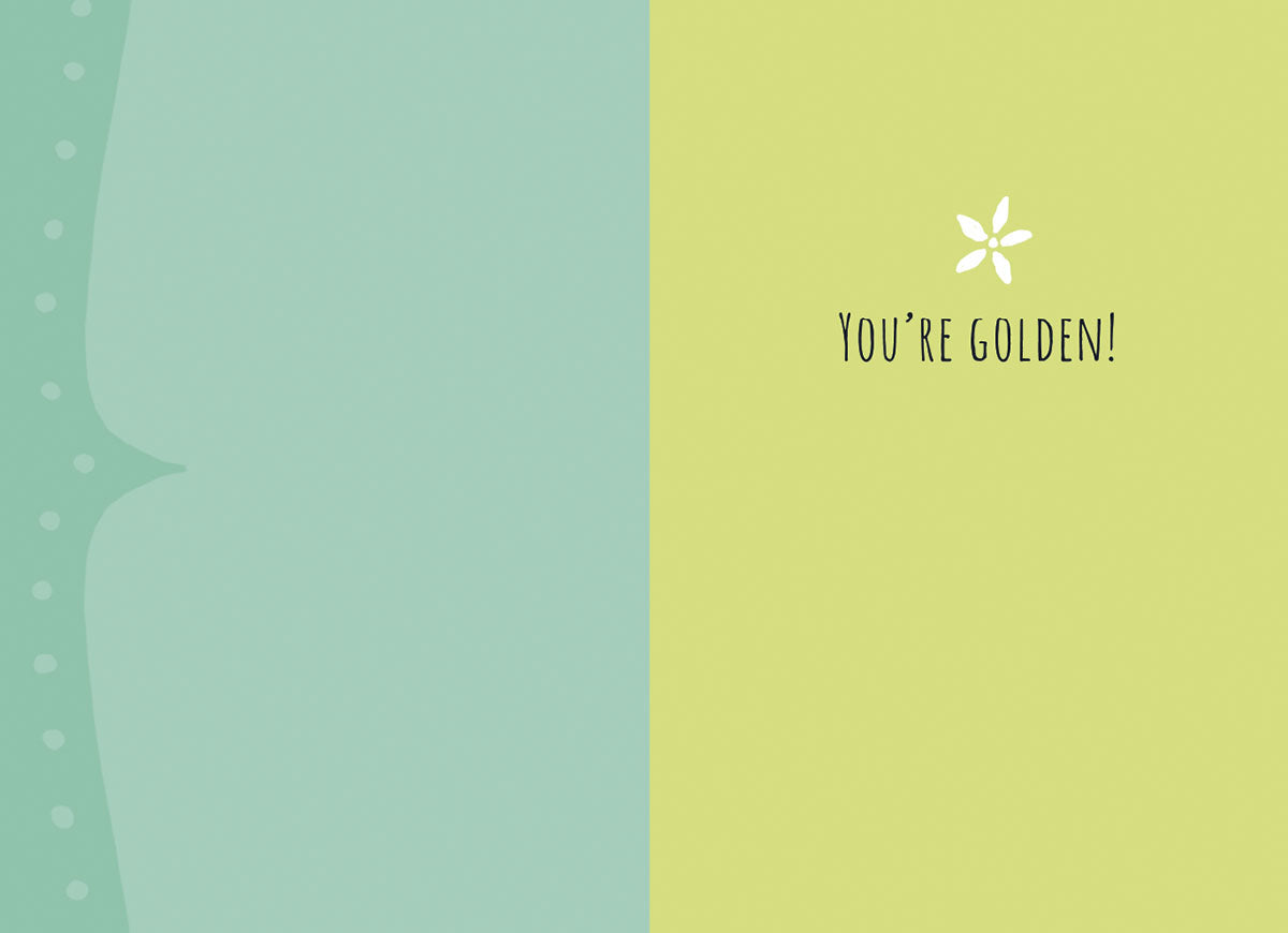 Inside of a greeting card with light green and blue panels, featuring a small flower and the text "YOU'RE GOLDEN!".