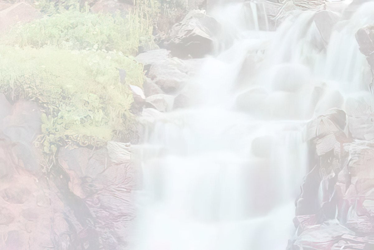 Soft focus, light version of the waterfall cascading over rocks.