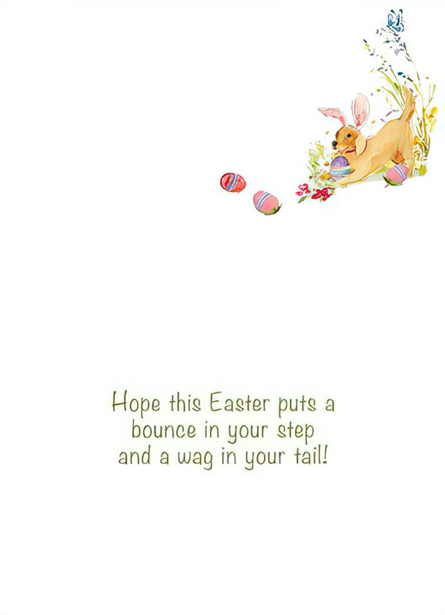 Inside of the Easter card features a happy golden dog with bunny ears playing with painted Easter eggs and a cheerful holiday message.
