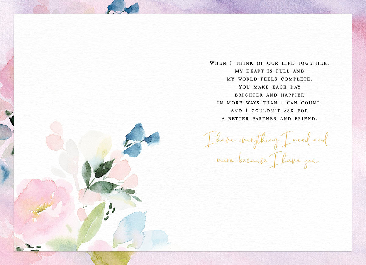 Inside of a heartfelt Valentine's Day card with a romantic message and pastel watercolor floral design.