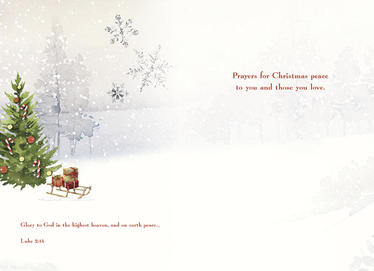 Inside of a religious Christmas card with a decorated tree, gifts, snowflakes, and scripture 'Prayers for Christmas peace' Luke 2:14.