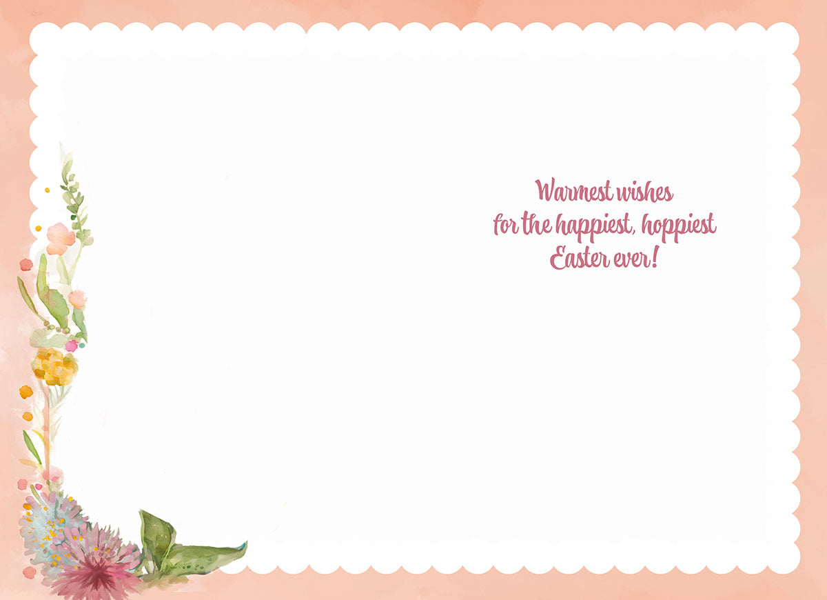 Inside of an Easter greeting card with 'Warmest wishes for the happiest, hoppiest Easter ever!' text and watercolor floral border.