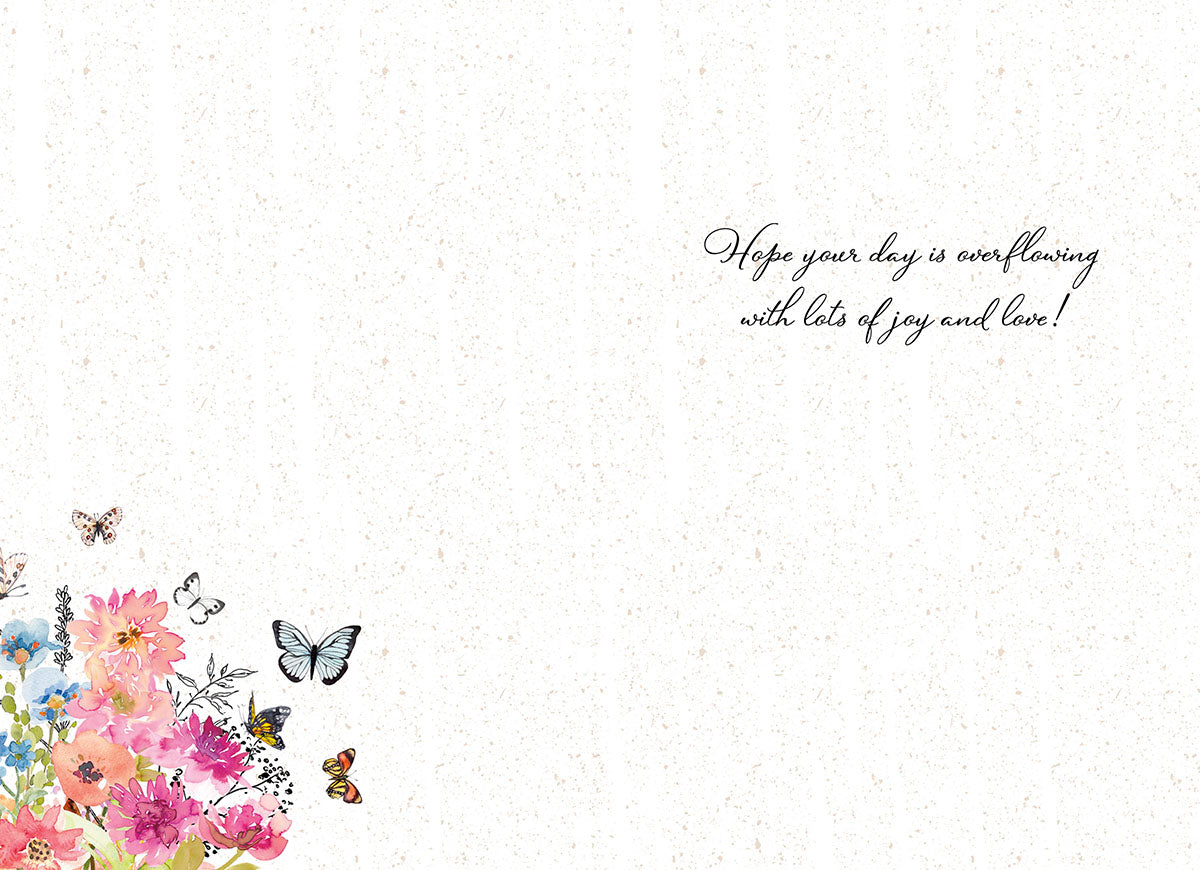 Inside of a Mother's Day card with a heartfelt message 'Hope your day is overflowing with lots of joy and love!' and floral accents.