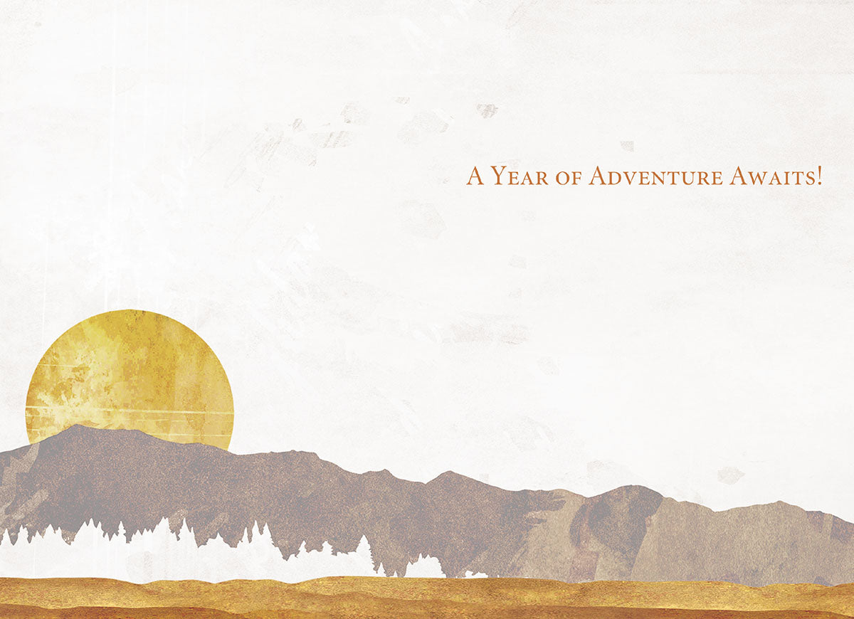 Inside of a birthday card with a mountain landscape and golden sun. Text reads 'A Year of Adventure Awaits!'.