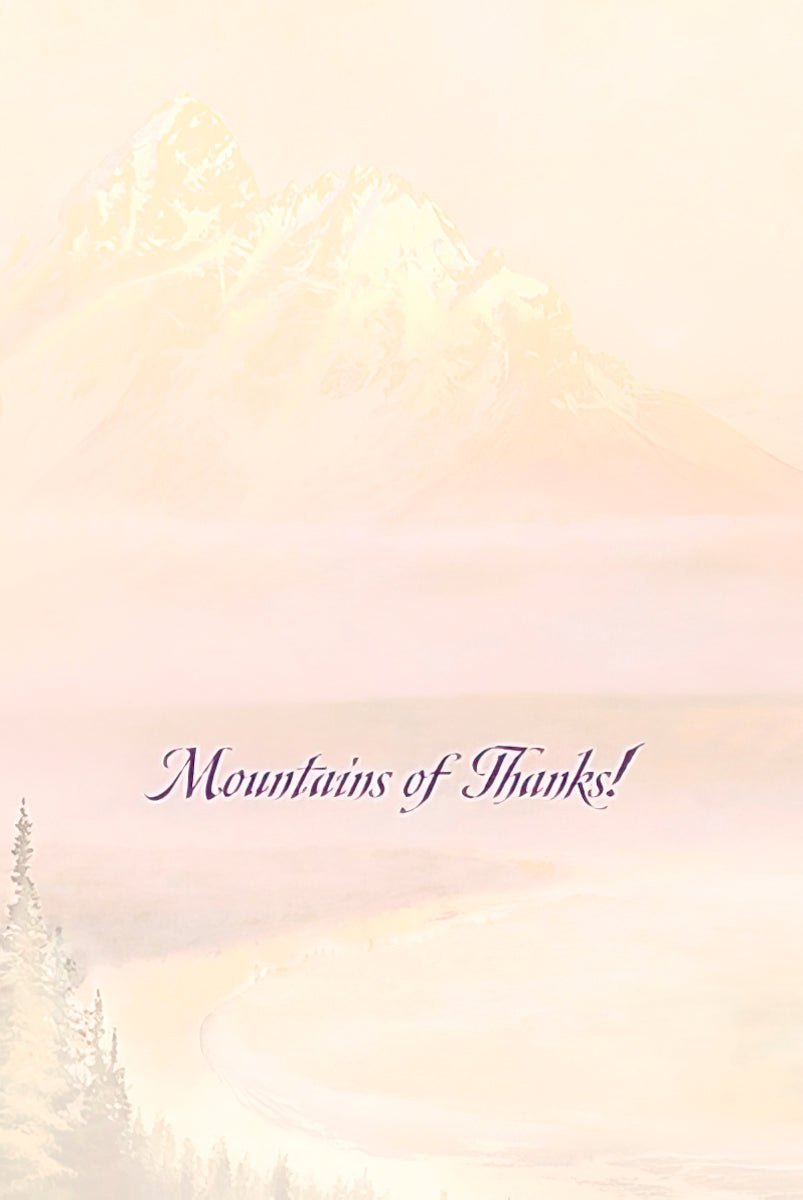 The inside of a greeting card featuring a faded mountain landscape background and the elegant script text 'Mountains of Thanks!'.