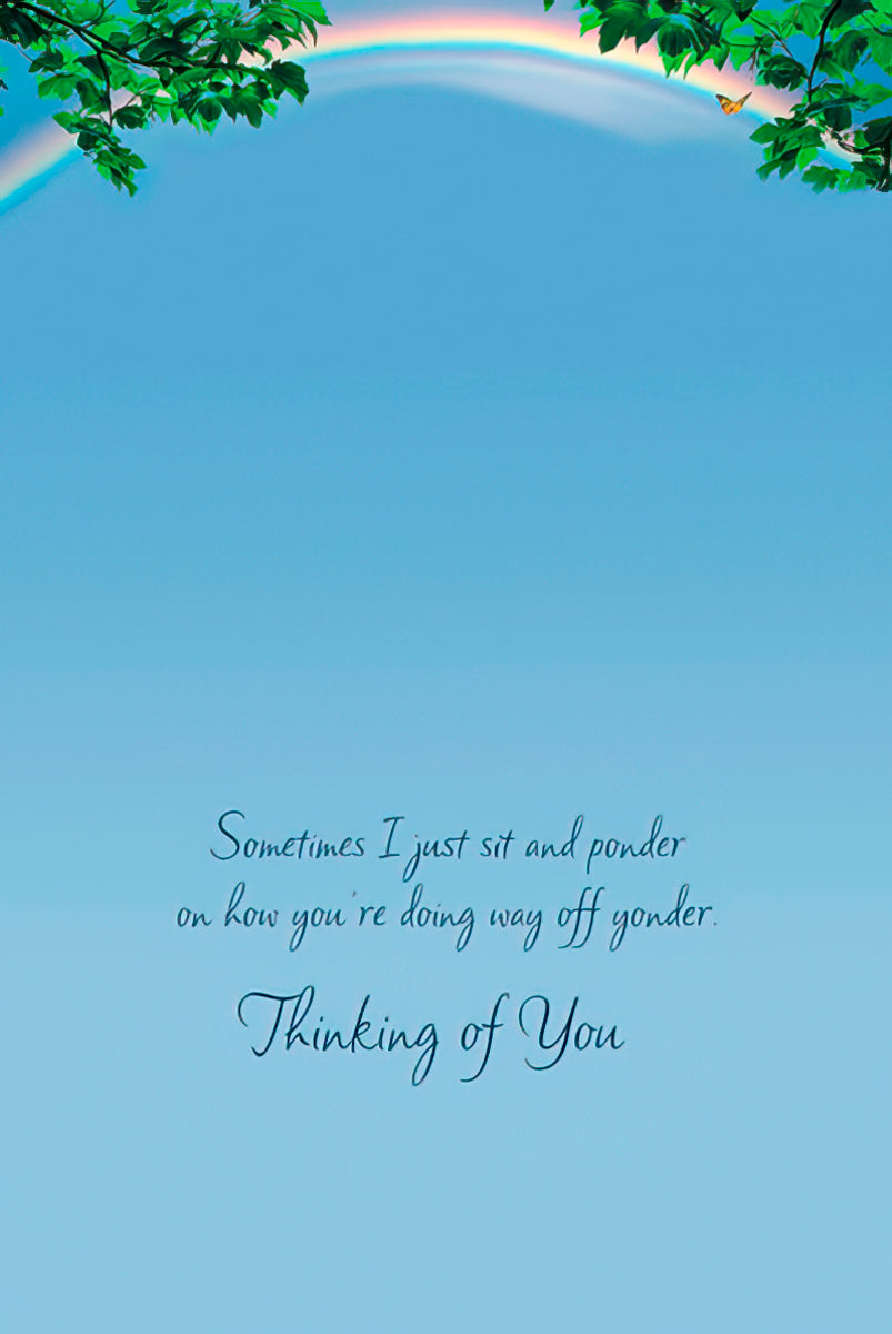 Inside a light blue greeting card with text: 'Sometimes I just sit and ponder on how you're doing way off yonder. Thinking of You'.