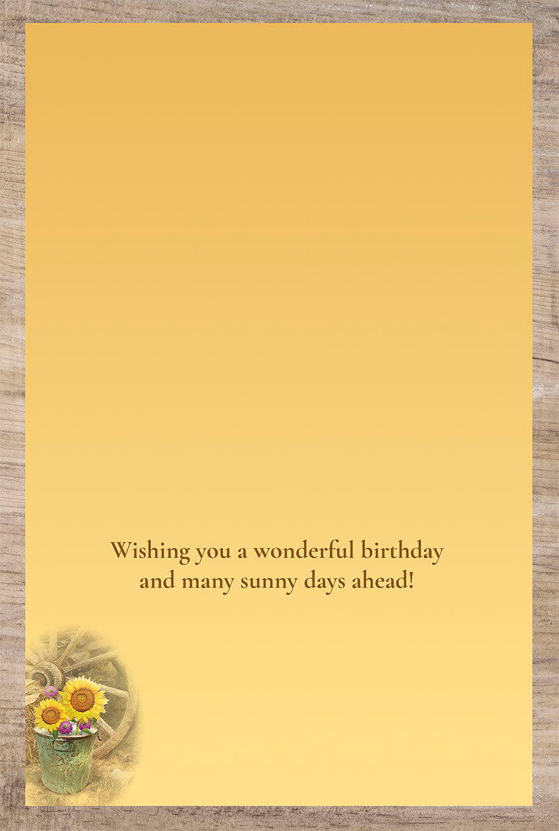 Inside of a birthday card with a warm message 'Wishing you a wonderful birthday and many sunny days ahead!'