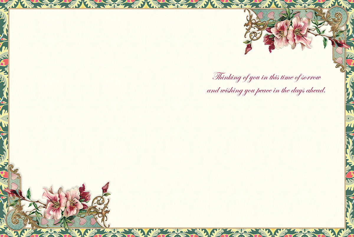Inside of a Victorian sympathy card with delicate floral corners and a printed message of peace and comfort.