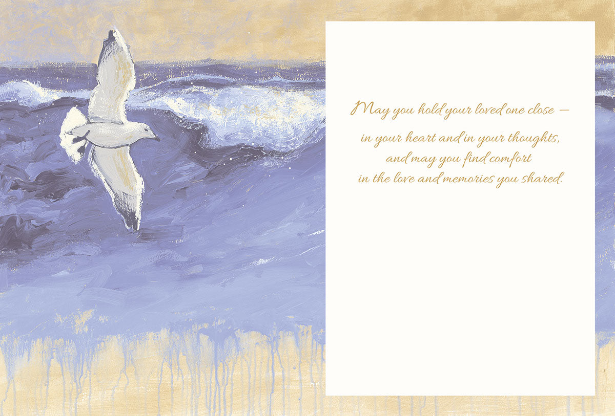 Inside of the sympathy card with the seagull and ocean artwork on the left and a heartfelt comfort message.