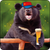 Bear with red cap holding a glass of beer