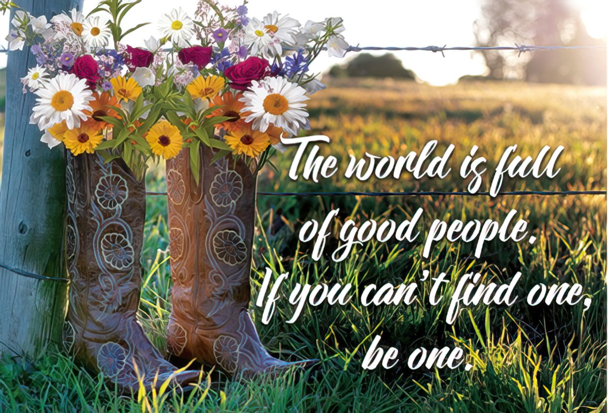 Magnet with cowboy boots holding wildflowers on a rustic fence, a field in the background. Text: "The world is full of good people. If you can't find one, be one."