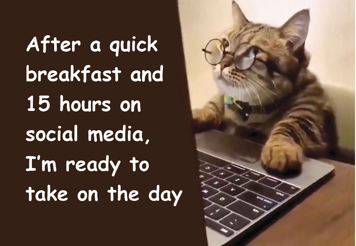 Funny cat wearing glasses typing on a laptop with the quote 'After a quick breakfast and 15 hours on social media, I'm ready to take on the day'.