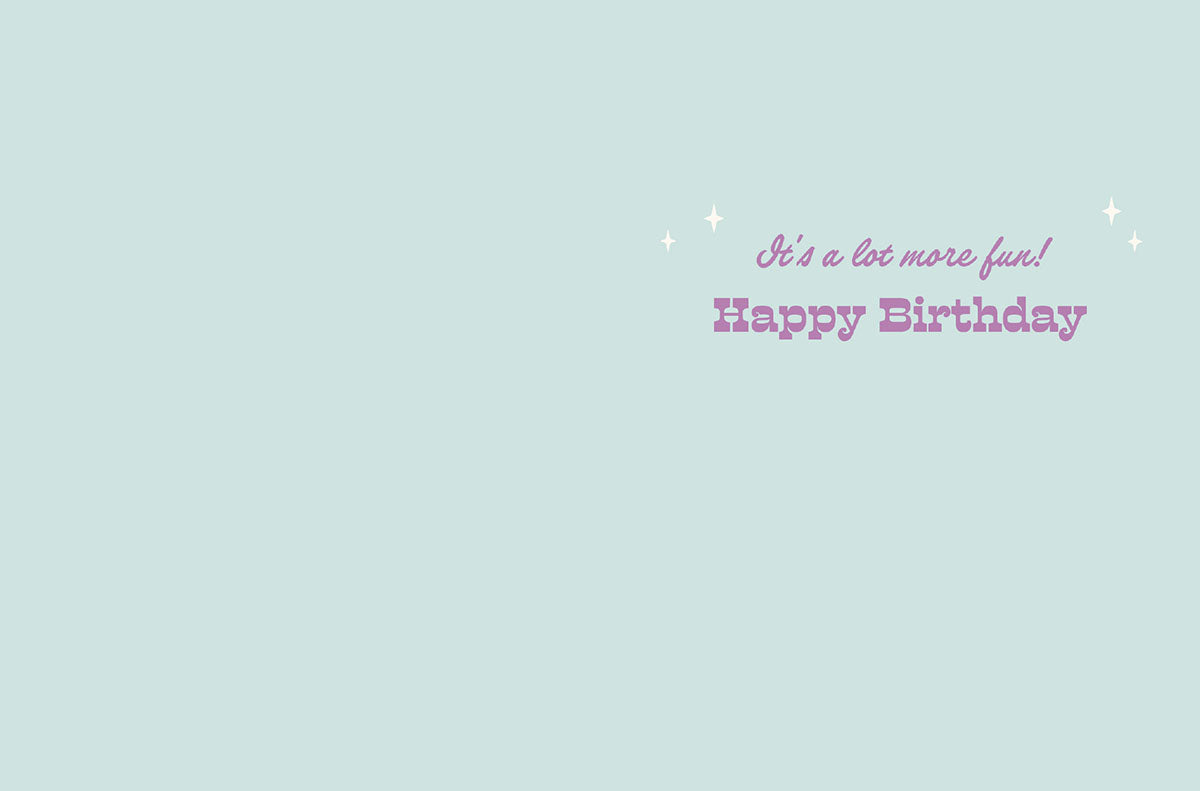 Inside of the birthday card, light blue background with "It's a lot more fun! Happy Birthday" in purple text.