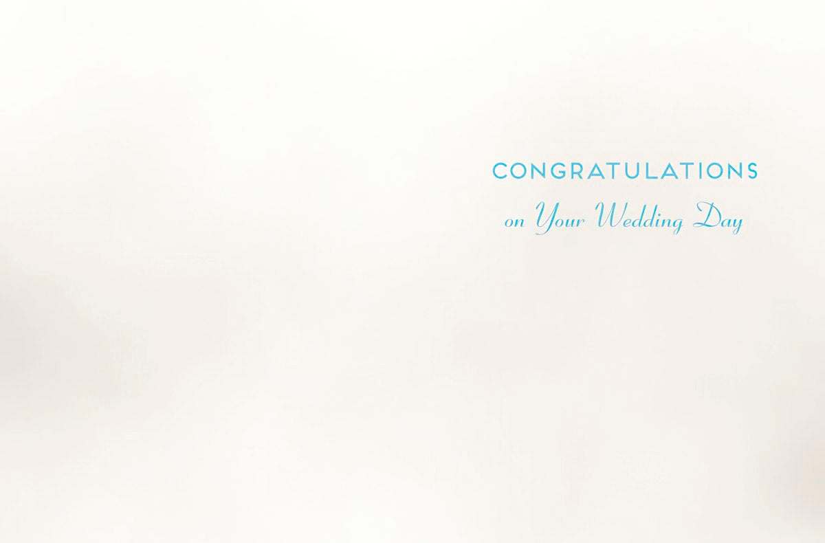 Inside of a wedding greeting card with blue text 'CONGRATULATIONS on Your Wedding Day' on a plain white background.