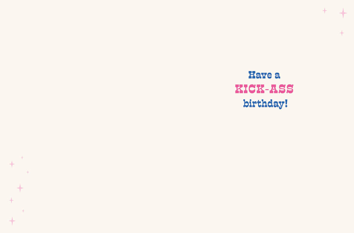 Inside of sassy birthday card with the empowering message 'Have a KICK-ASS birthday!' in pink and blue text.