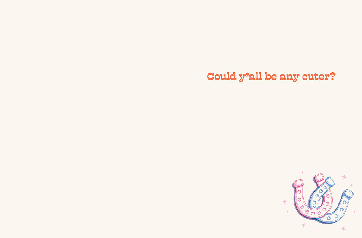 Inside of a wedding card with the text 'Could y'all be any cuter?' and a small illustration of pink and blue horseshoes in the corner.