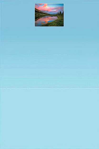 Blank card interior showcasing a peaceful mountain lake reflecting a dramatic pink cloudy sky, John Fielder, light blue gradient inside.