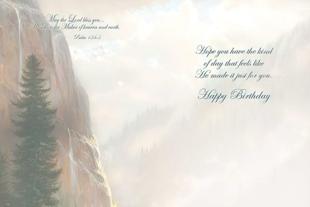 Inside of a religious birthday card with a soft, ethereal mountain and forest background. The text on the left reads: 'May the Lord bless you... ...Who made the Maker of heaven and earth. Psalm 121:2'. The text on the right reads: 'Hope you have the kind of day that feels like He made it just for you. Happy Birthday.'
