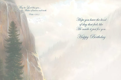 Inside of a religious greeting card with a serene mountain backdrop, featuring 'Happy Birthday' and a hopeful blessing.