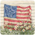 Vintage American flag coaster art with 34 stars, weathered red, white, and blue fabric, surrounded by white daisy flowers and small butterflies, set against a rustic white wood panel background. Ideal patriotic home decor.
