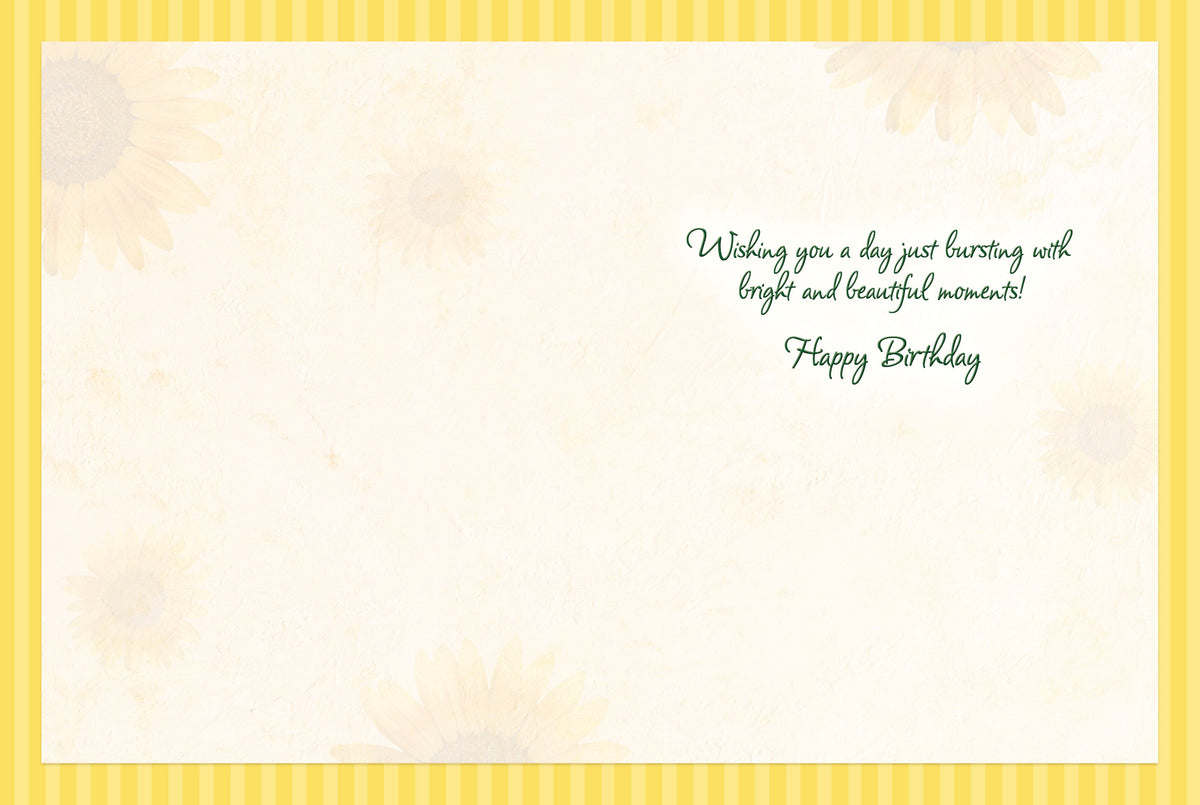 Inside of a lighthearted greeting card with a yellow striped border and subtle sunflower watermarks. Features green cursive text: 'Wishing you a day just bursting with bright and beautiful moments! Happy Birthday'.