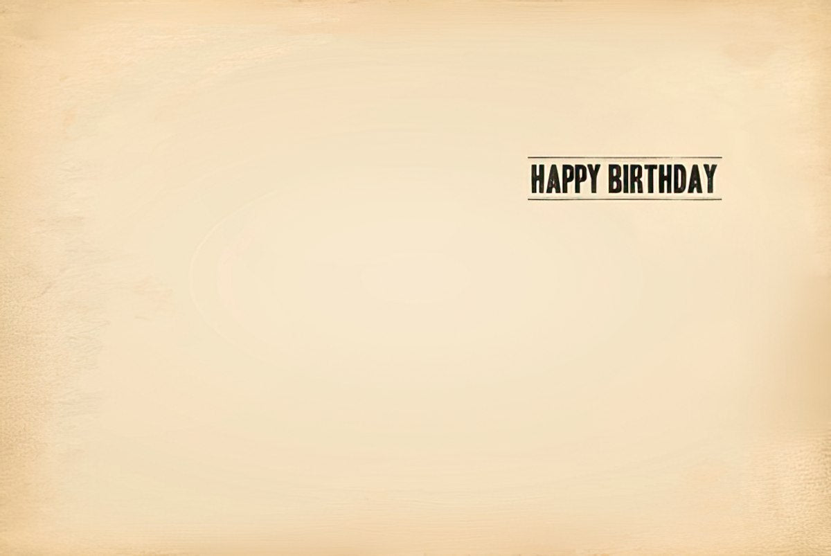 Inside of a vintage-look greeting card with 'HAPPY BIRTHDAY' printed in an old newspaper font on a cream background.