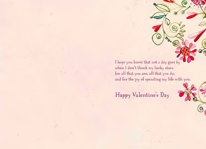 Inside of a Valentine's Day card for wife, showing a heartfelt message of love and gratitude with decorative floral accents.