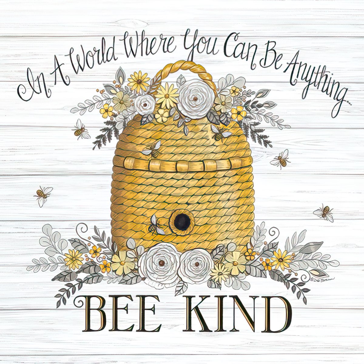 A decorative magnet featuring a golden beehive surrounded by yellow and white flowers, green leaves, and flying bees, set against a white rustic wooden background. The text reads: 'In A World Where You Can Be Anything... BEE KIND' in elegant script and bold serif fonts.
