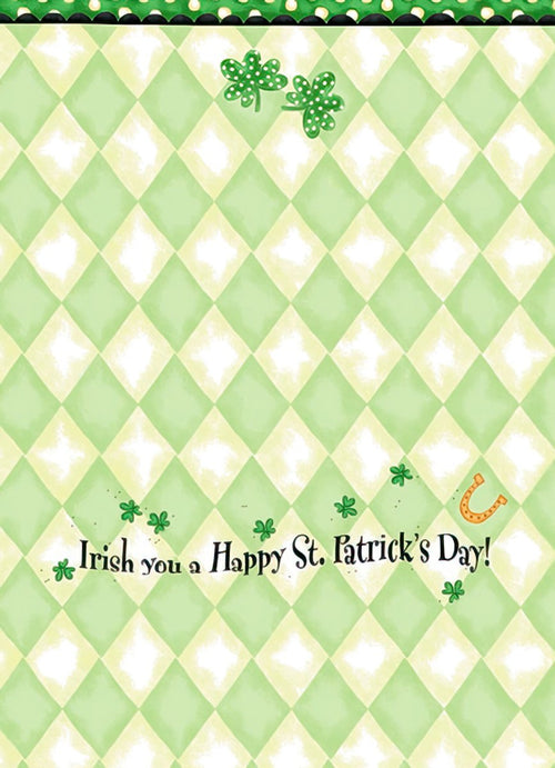 Inside of a St. Patrick's Day greeting card with a pale green argyle pattern background, featuring scattered green shamrocks, a small golden horseshoe, and the playful greeting 'Irish you a Happy St. Patrick's Day!'
