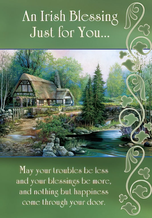 St. Patrick's Day Irish Blessing card front featuring a charming green cottage by a river with Celtic border. Text: 'May happiness come through your door.'