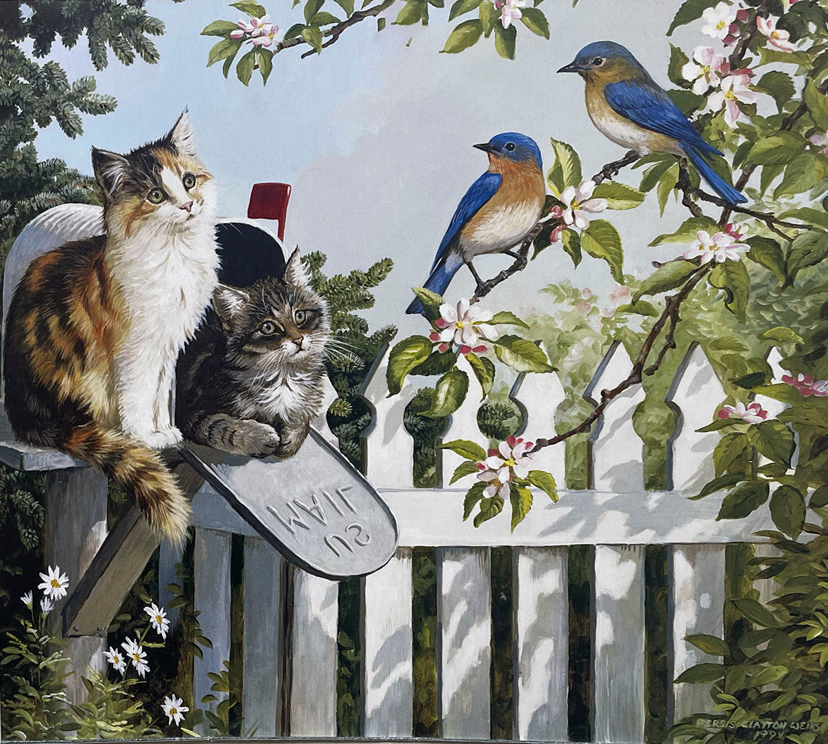 A calico cat perched on a country mailbox with a small tabby kitten inside, observing two bluebirds on a branch next to a white picket fence in a spring garden.