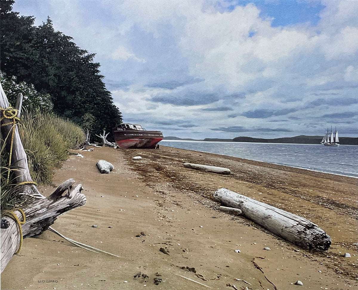 Scenic sandy beach with driftwood, an old boat ashore, and a majestic tall ship sailing on the horizon.