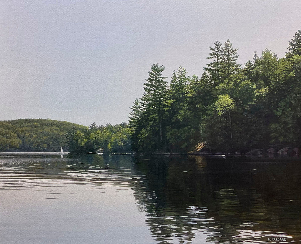 Calm lake reflecting towering evergreen trees, with a tiny sailboat in the distance under a bright sky.