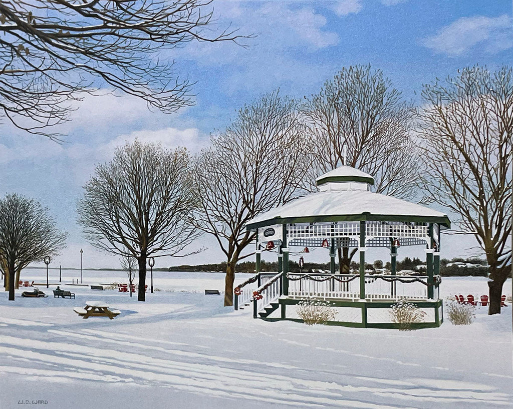 Idyllic winter park featuring a white gazebo adorned with festive decorations, surrounded by snow and bare trees.
