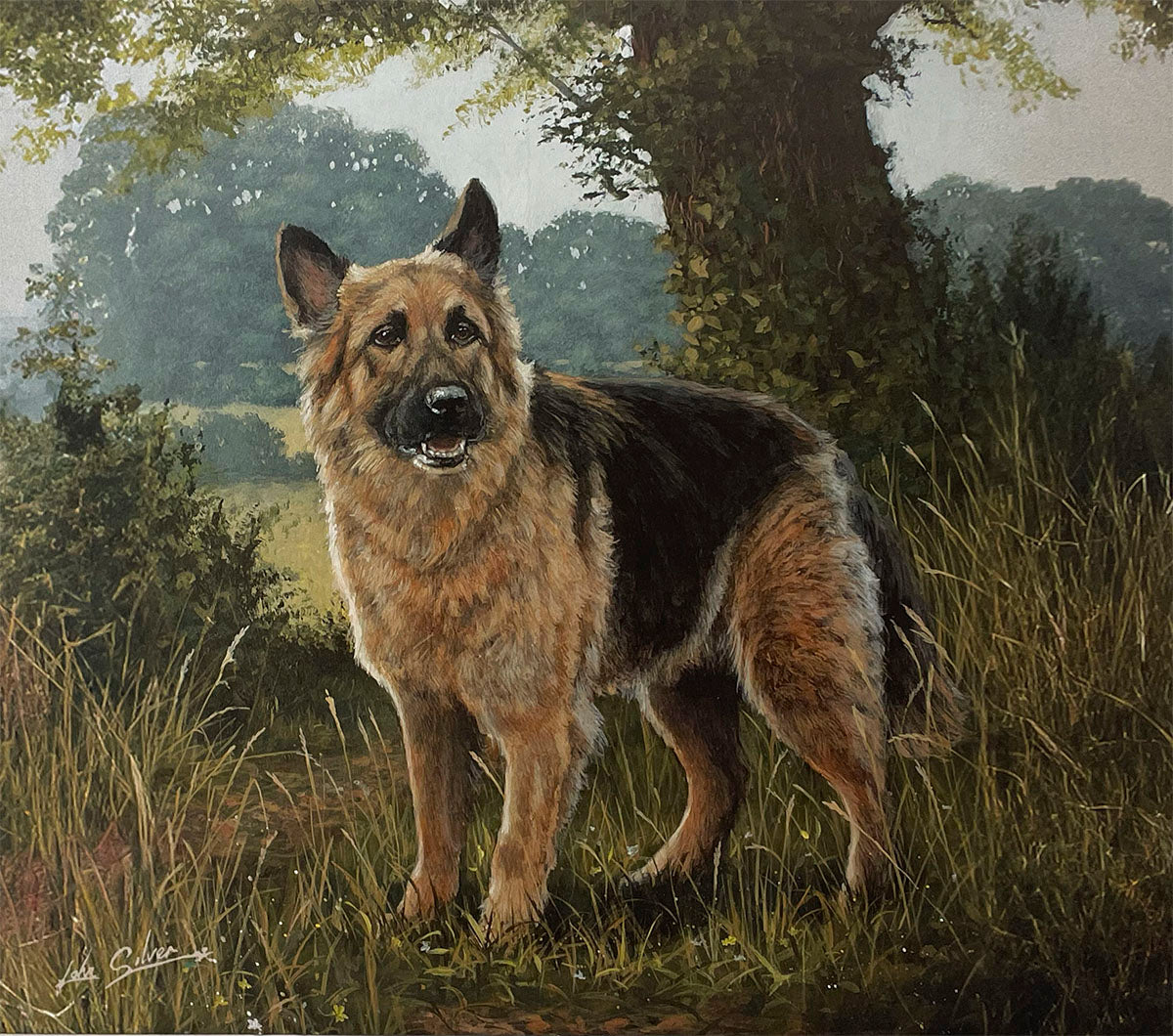 A regal German Shepherd dog stands confidently in a natural landscape, with a lush green field and a large tree in the background, showcasing its strong physique.