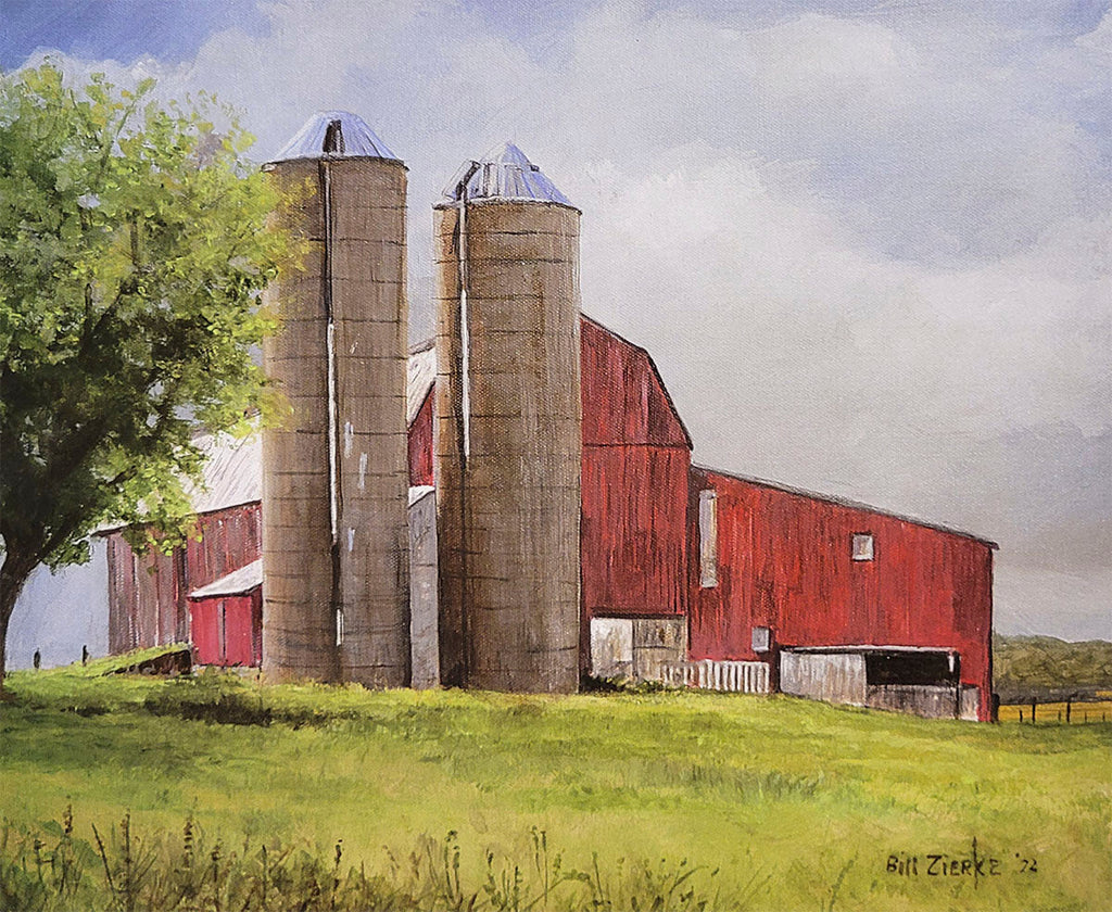 Panoramic farm view painting by Bill Zierke, showcasing a red barn, two silos, and a lush green tree on a gentle hillside.