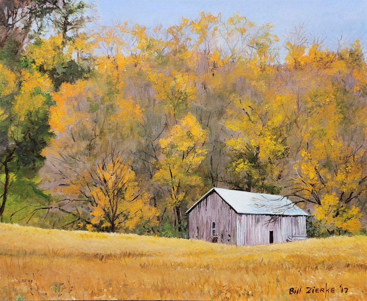 Peaceful autumn landscape with a weathered white barn nestled among golden fields and brilliant fall trees by Bill Zierke.