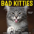 Bad Kitties 2027 18-month wall calendar cover featuring a fluffy grey and white cat with its tongue out and paw up, with text 'CURRENT STATUS: BUFFERING.' and 'Celebrating Good Times & Bad Behavior'. Perfect funny cat calendar for pet lovers and humor enthusiasts.