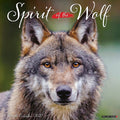 Spirit of the Wolf 2027 wall calendar cover featuring a captivating close-up of a majestic grey wolf with intense amber eyes, showcasing its beautiful fur against a soft green background.