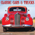 Front view of a vibrant red 1940s Packard convertible classic car with a tan soft top, parked on an asphalt road against a blue sky, cover of a 2027 Classic Cars & Trucks 18-Month Wall Calendar.