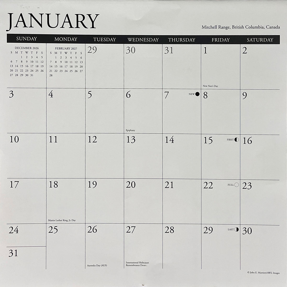 Close-up of a wall calendar's January 2026 month grid, showing dates, moon phases, and various observed holidays like New Year's Day, Martin Luther King Jr. Day, Australia Day, and International Holocaust Remembrance Day. SEO: January 2026 calendar page, monthly grid, holidays, date planner, wall calendar functionality.