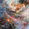 Vibrant and colorful nebula filled with countless sparkling stars, featuring a celestial blend of reds, blues, and whites.