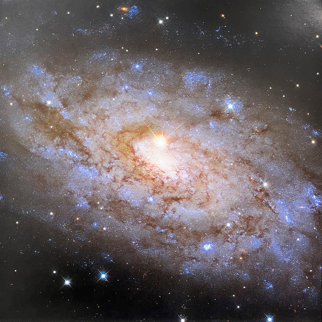 Magnificent barred spiral galaxy with a radiant central bar, bright core, and delicate, swirling star-forming regions.