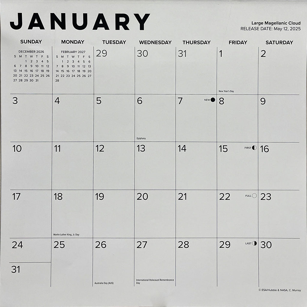 Close-up detail of a wall calendar page for January, displaying the month, dates, important holidays, and space image credit information.