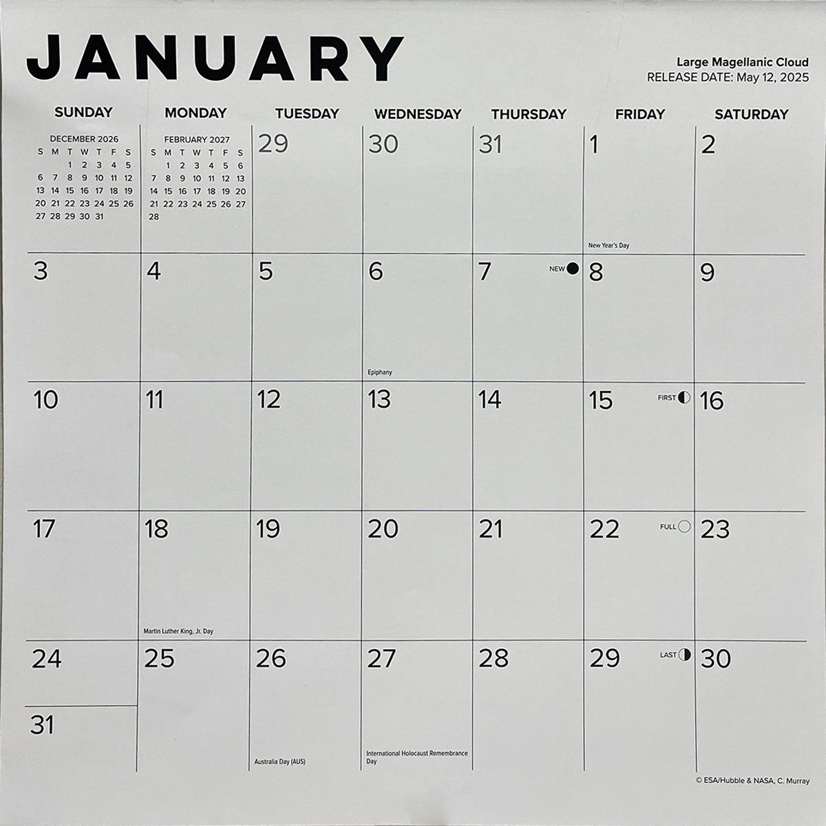Close-up detail of a wall calendar page for January, displaying the month, dates, important holidays, and space image credit information.