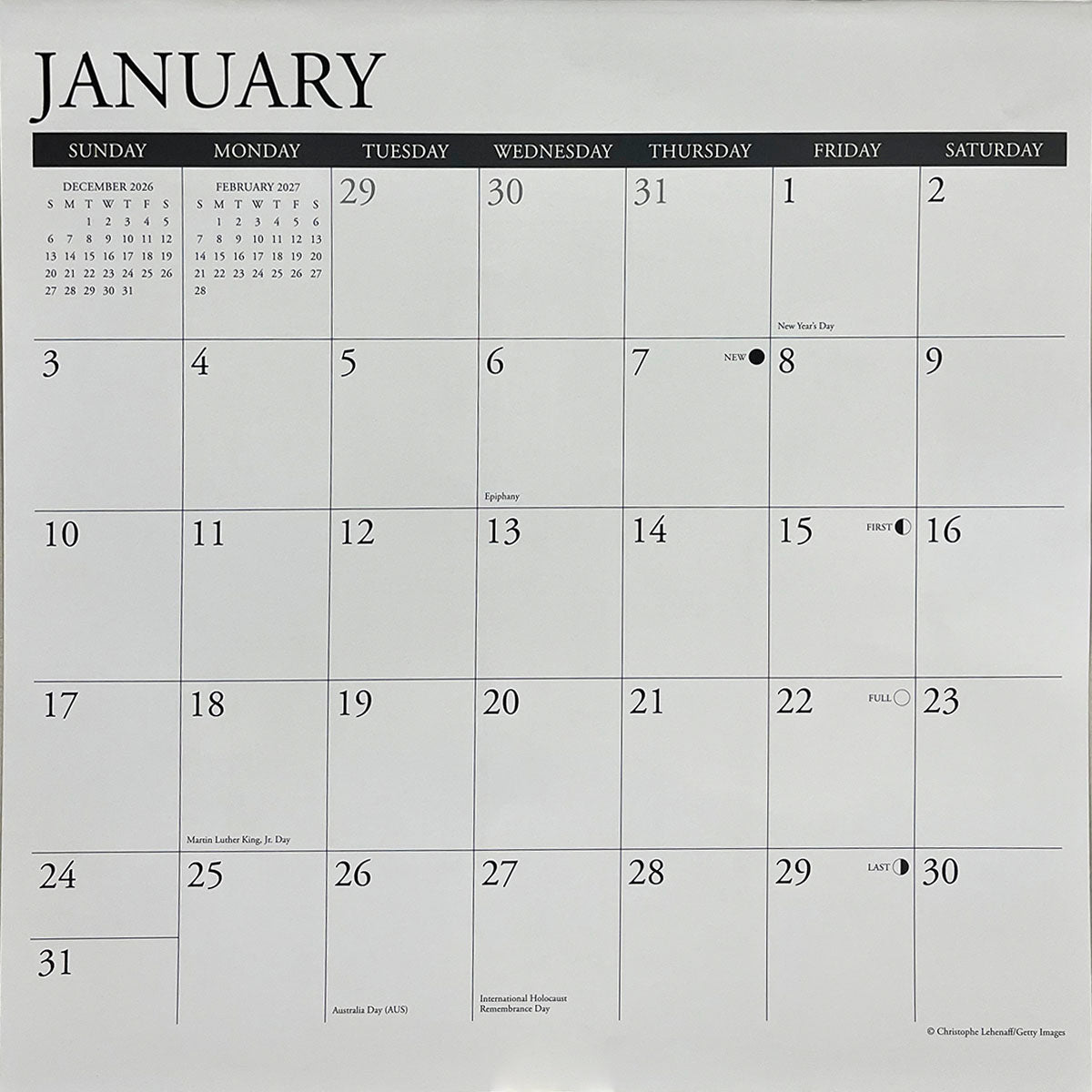 Close-up of a calendar page showing January 2024 with dates, holidays, and ample space for planning events.