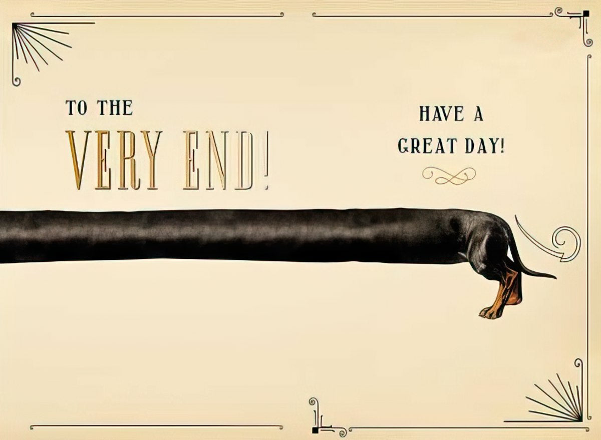Inside of a humorous birthday card showing an exaggeratedly long black dachshund body with its tail and hind legs visible, continuing the vintage border theme. Text reads 'TO THE VERY END! HAVE A GREAT DAY!'.