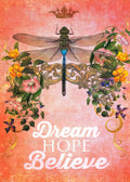 Vintage style magnet featuring a large green and blue dragonfly with delicate wings, surrounded by gold ornate scrolls and vibrant floral accents in pink, yellow, and purple on a textured coral background. The inspiring words 'Dream HOPE Believe' are written in white script, topped by a small gold crown. Perfect for adding a touch of motivation and beauty to any magnetic surface.