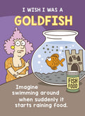 Cartoon magnet featuring a pink-haired woman looking longingly at a happy goldfish in a bowl. Text reads 'I WISH I WAS A GOLDFISH' and 'Imagine swimming around when suddenly it starts raining food.' A jar of fish food is visible next to the bowl.