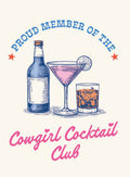 Vintage style magnet featuring a beer bottle, pink martini, and whiskey glass with text 'Proud Member of the Cowgirl Cocktail Club' in blue and pink script, perfect for cocktail enthusiasts.